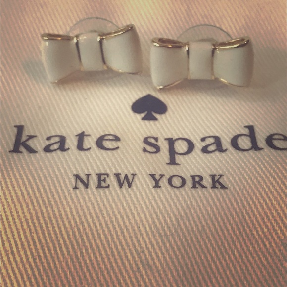 kate spade Jewelry - Kate Spade white/cream bow earrings with gold trim
